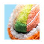 A close up detail of the Jellycat Amuseables Codhi Californian Roll plush toy, showcasing the textured orange, white, green, and yellow fabrics mimicking sushi ingredients.