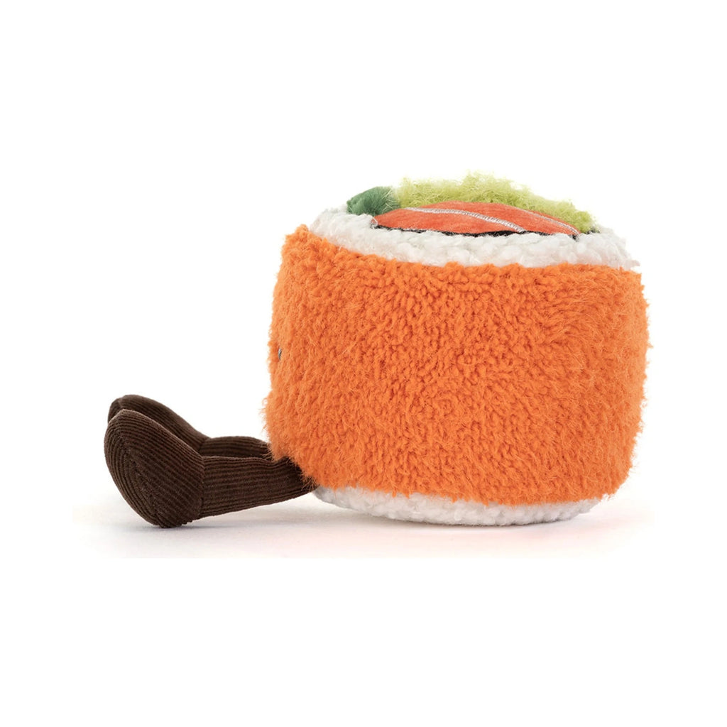 A side view of the Jellycat Amuseables Codhi Californian Roll plush toy with a bright orange textured exterior, white rice borders, and a colorful filling of green and orange on top, complete with dangling dark brown corduroy legs.