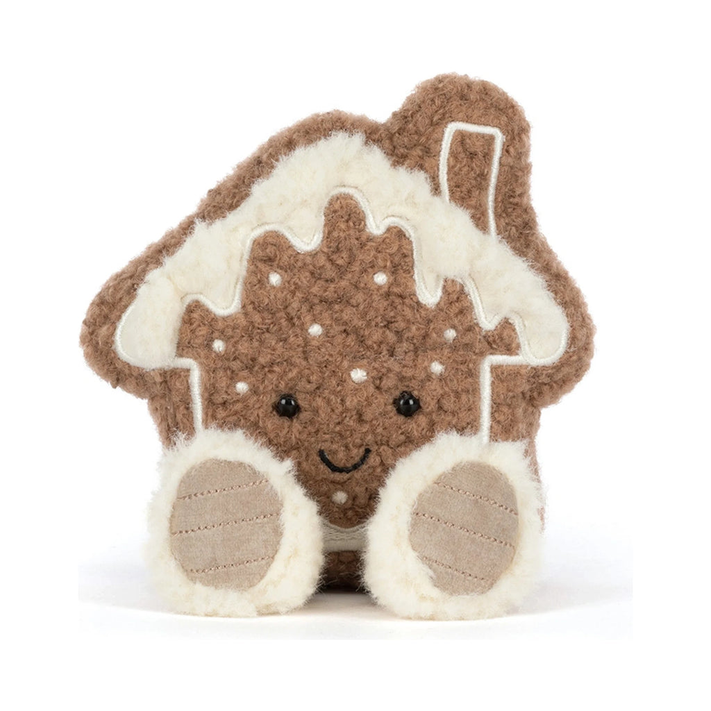 Front view of Jellycat Amuseables Molasi Cookie showing smiling embroidered face with dotted.