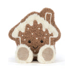 Front view of Jellycat Amuseables Molasi Cookie showing smiling embroidered face with dotted.