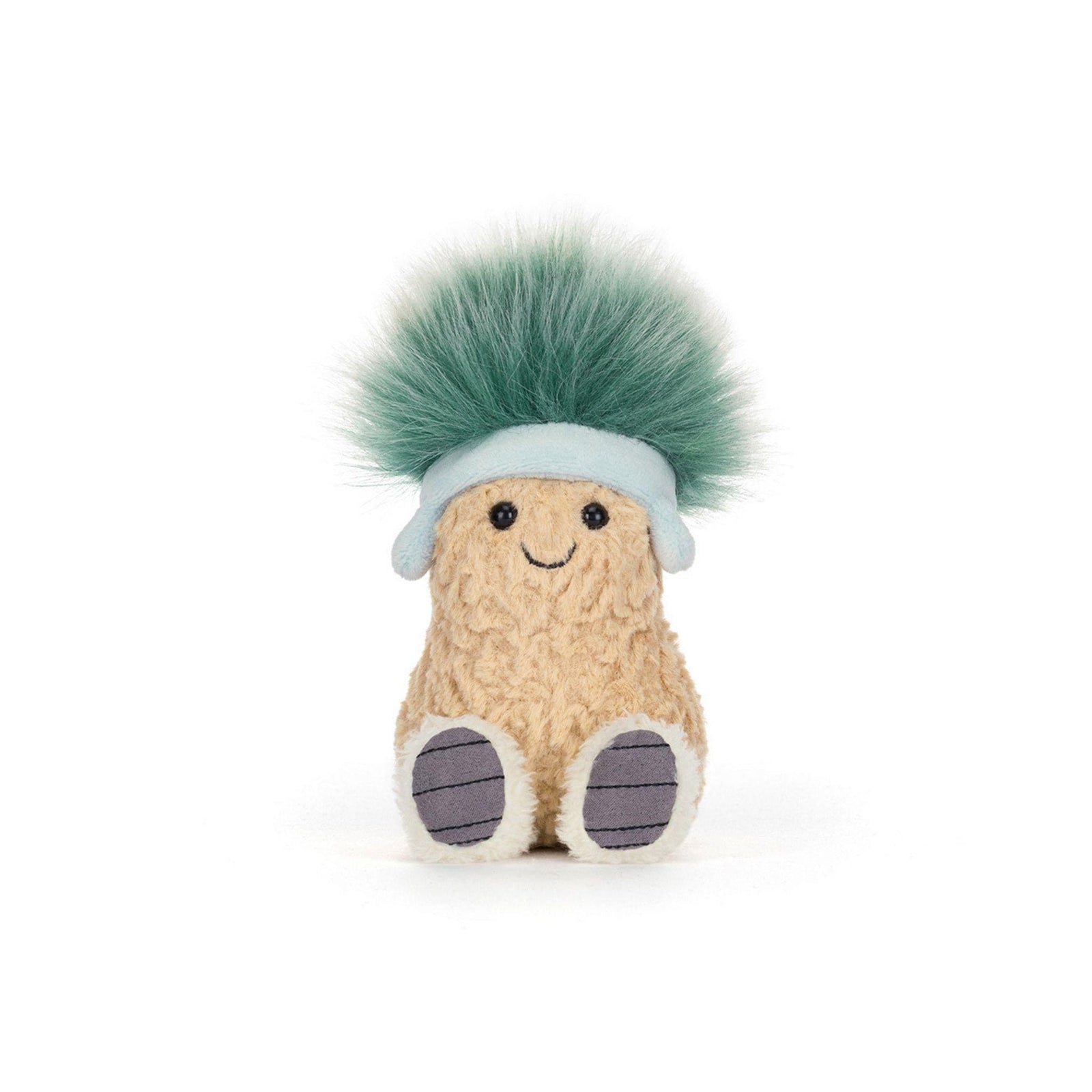 A textured tan plush peanut character with a smiling face, wearing a pale blue headband with earflaps and sporting a large, fuzzy tuft of teal-green hair.