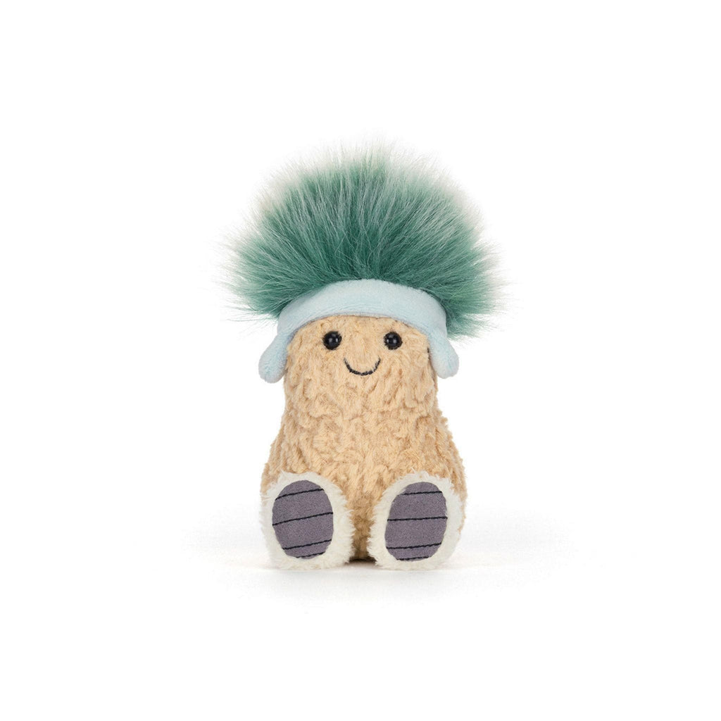 A textured tan plush peanut character with a smiling face, wearing a pale blue headband with earflaps and sporting a large, fuzzy tuft of teal-green hair.