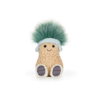 A textured tan plush peanut character with a smiling face, wearing a pale blue headband with earflaps and sporting a large, fuzzy tuft of teal-green hair.