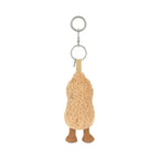A plush peanut-shaped keychain charm in a textured tan fleece, featuring small brown feet and a silver metal key ring at the top, shown against a plain white background.