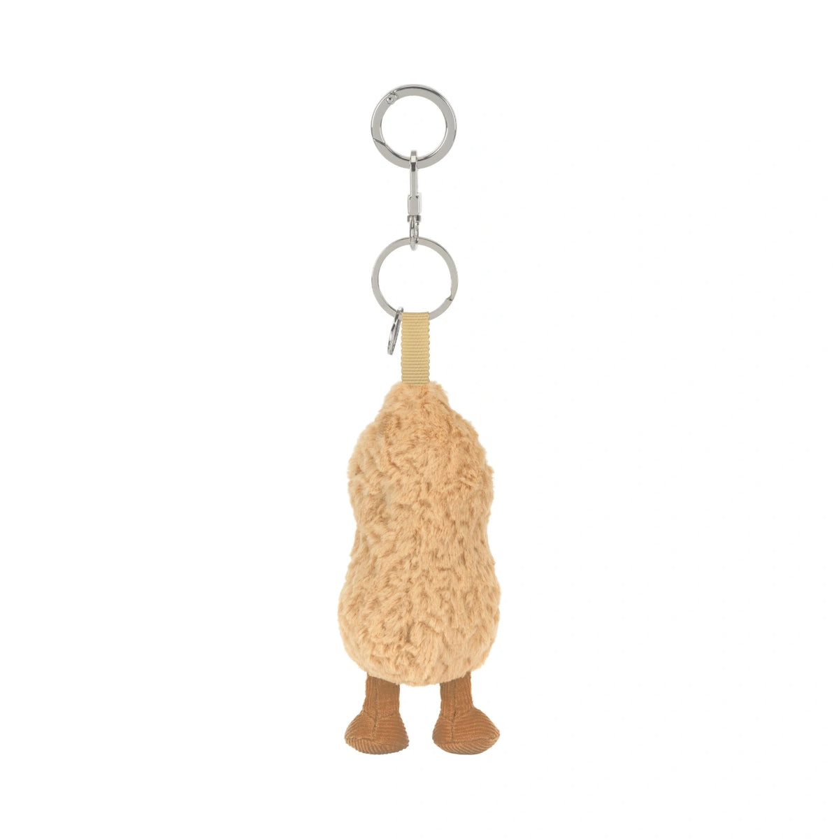A plush peanut-shaped keychain charm in a textured tan fleece, featuring small brown feet and a silver metal key ring at the top, shown against a plain white background.