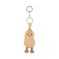 A plush peanut-shaped keychain charm with a smiling embroidered face, attached to silver metal key rings and a beige fabric loop, shown on a plain white background.