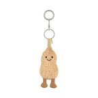 A plush peanut-shaped keychain charm with a smiling embroidered face, attached to silver metal key rings and a beige fabric loop, shown on a plain white background.