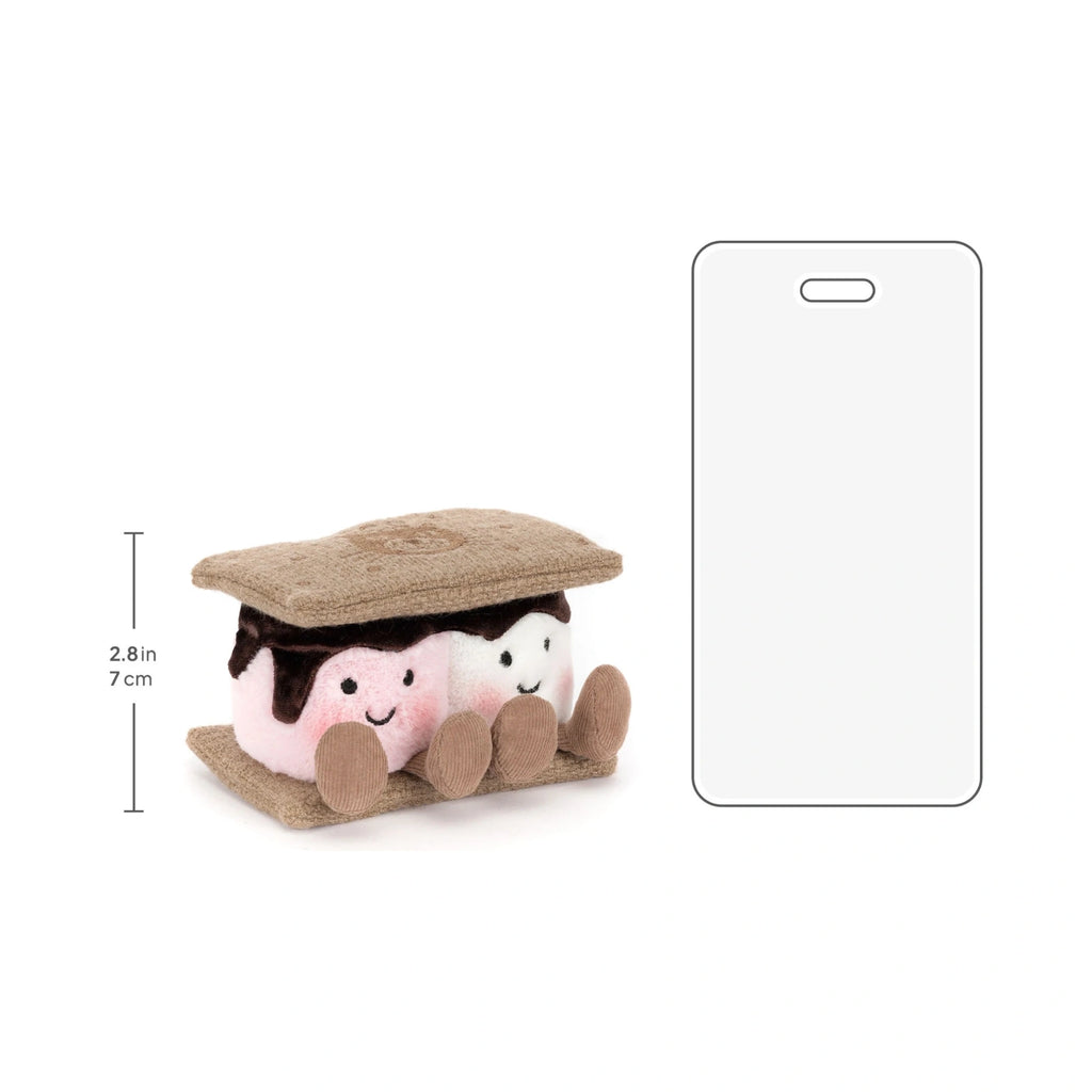Jellycat Amuseables Smores plush next to a 7 cm ruler and smartphone graphic for size comparison.