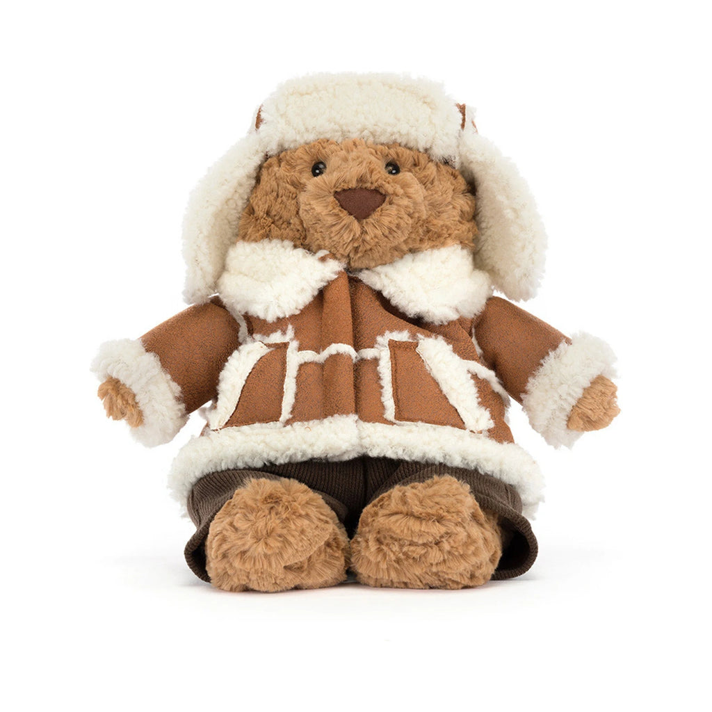 Front view of Jellycat Bartholomew Bear Alpine showing knitted brown plush trousers.