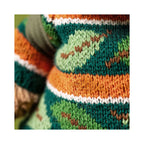 Close up detail of Jellycat Bartholomew Bear Hiking Outfit showing vibrant knitted yarn stripes.