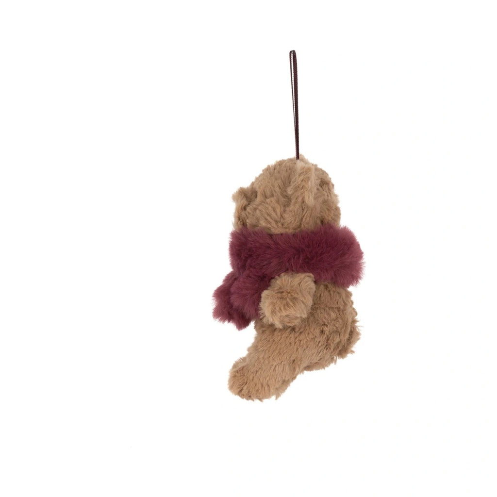 Side view of Jellycat Bartholomew Bear Winter Warmer Decoration showing brown hanging ribbon loop.