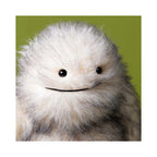Close up detail of Jellycat Bretti Yeti showing fluffy white plush fur and smiling embroidered mouth.