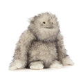 Front view of Jellycat Bretti Yeti showing fluffy grey and white plush fur and a smiling embroidered expression.