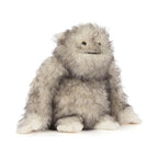 Front view of Jellycat Bretti Yeti showing fluffy grey and white plush fur and a smiling embroidered expression.