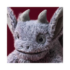 Close-up of detailed soft grey face on Jellycat Growlston Gargoyle.