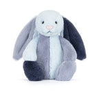 A Jellycat Puddlesea Bunny Original plush toy featuring color blocked patchwork fur in light blue, slate grey, and dark navy blue with a pink nose.