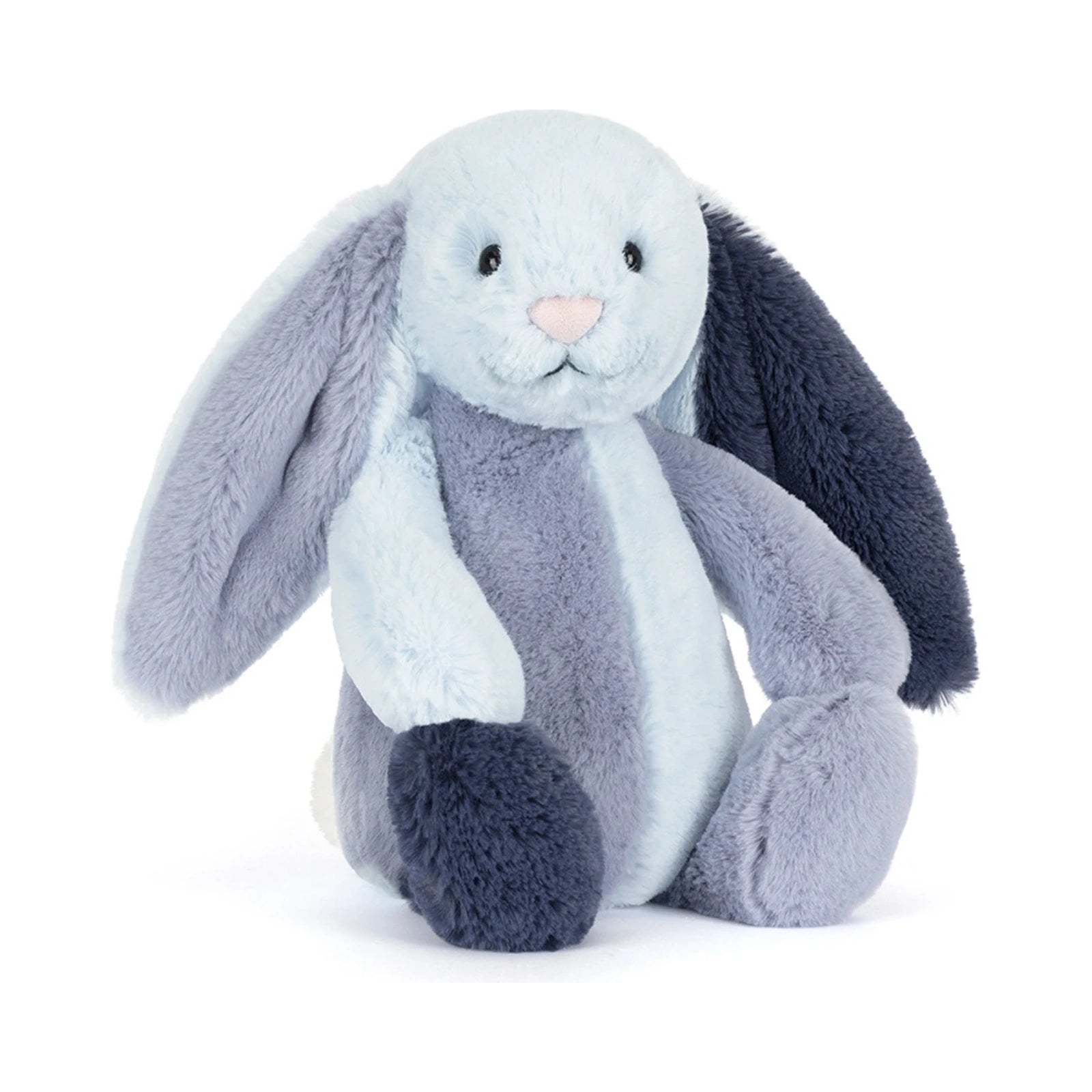 The Jellycat Puddlesea Bunny Original plush toy features a soft patchwork design with various shades of light blue, dusty blue, and dark navy blue fur, long floppy ears, and a small pink nose.