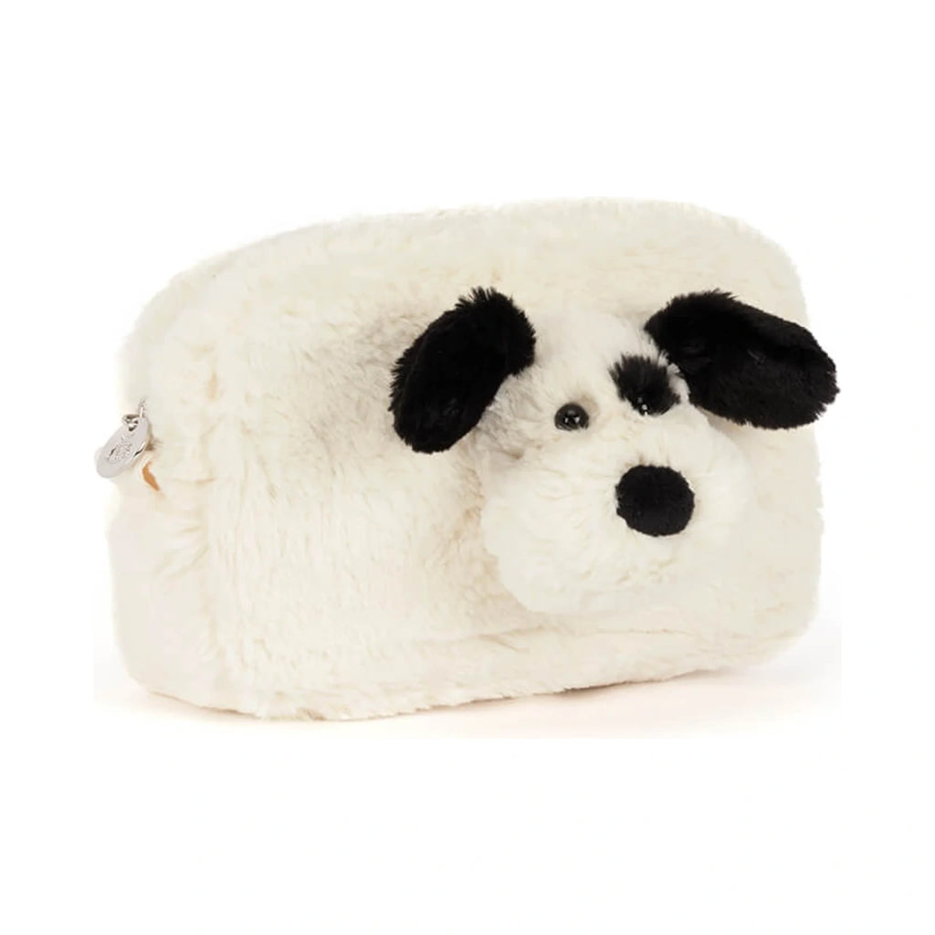 Front view of Jellycat Rufferty Puppy Pouch showing fluffy cream plush fur and soft black velvet ears.