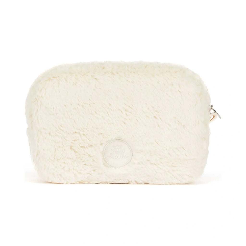 Back view of Jellycat Rufferty Puppy Pouch showing soft cream plush fur and a round embossed brand patch.