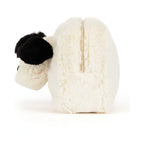 Side view of Jellycat Rufferty Puppy Pouch showing fluffy creamy plush body with distinct black soft ears.