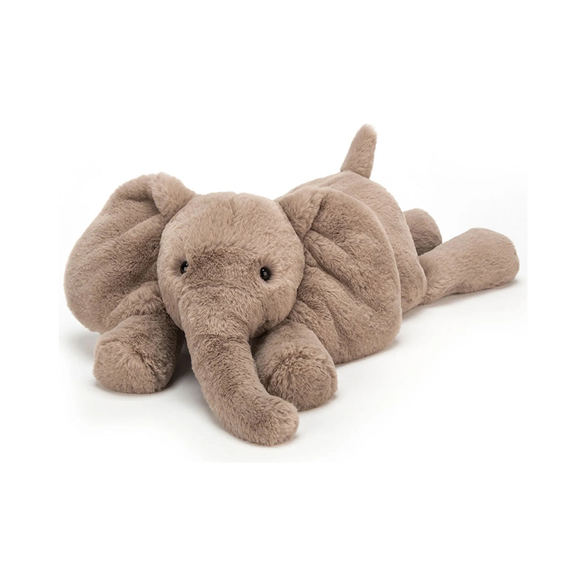 A Jellycat Smudge Elephant Medium plush toy lying down in a relaxed floppy pose, featuring soft taupe grey fur, large floppy ears, a curved trunk, and small black button eyes.