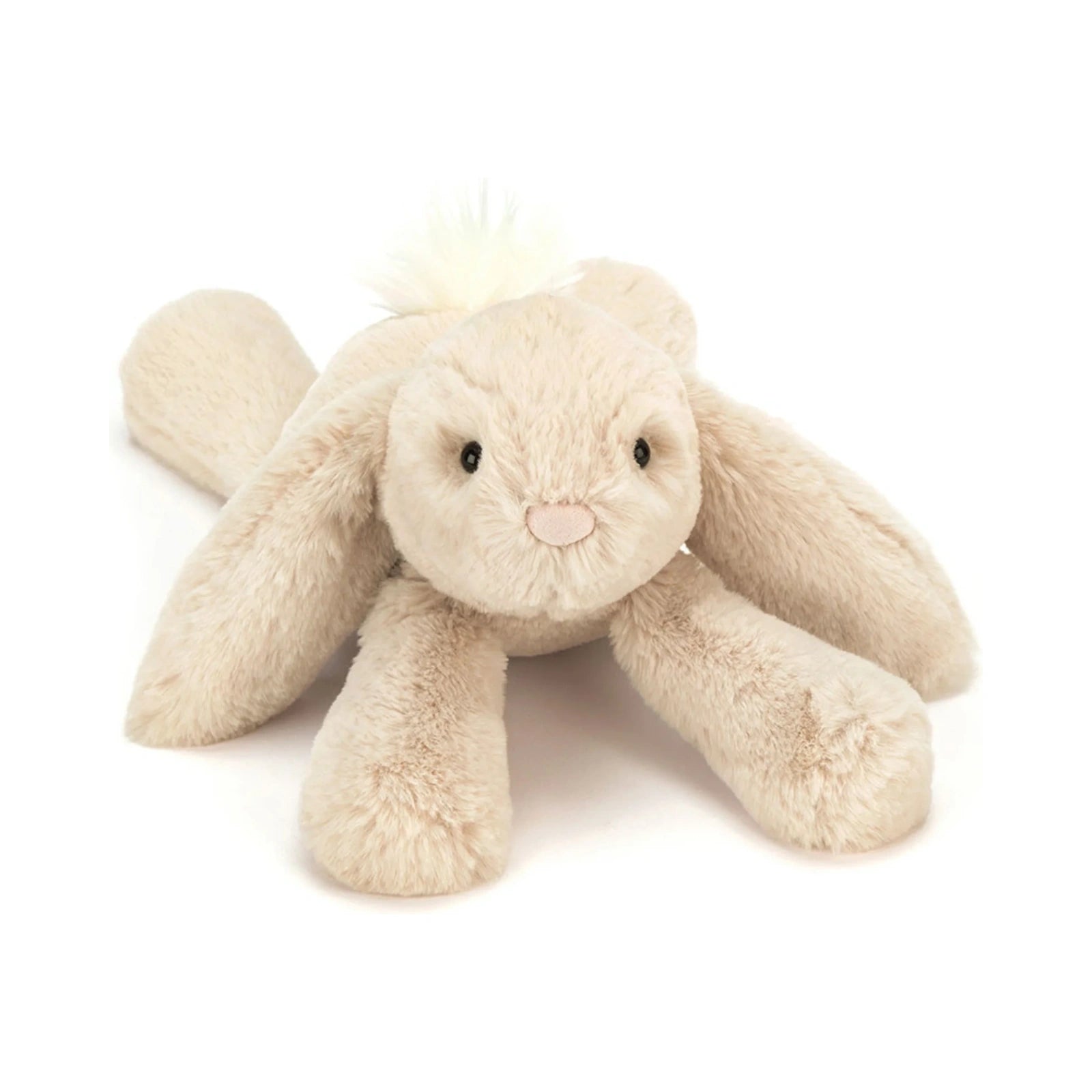 Jellycat Smudge Rabbit Medium stuffed animal in soft beige plush lying down with long floppy ears and a fluffy white tail.