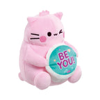Pembe the Pink Cat small soft toy features a cute embroidered face with pink cheeks and holds a teal circular medallion displaying the text Be You in purple lettering.
