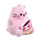 Pembe the Pink Cat small soft toy features a pink plush kitty holding a white coffee cup decorated with pink hearts and stripes.