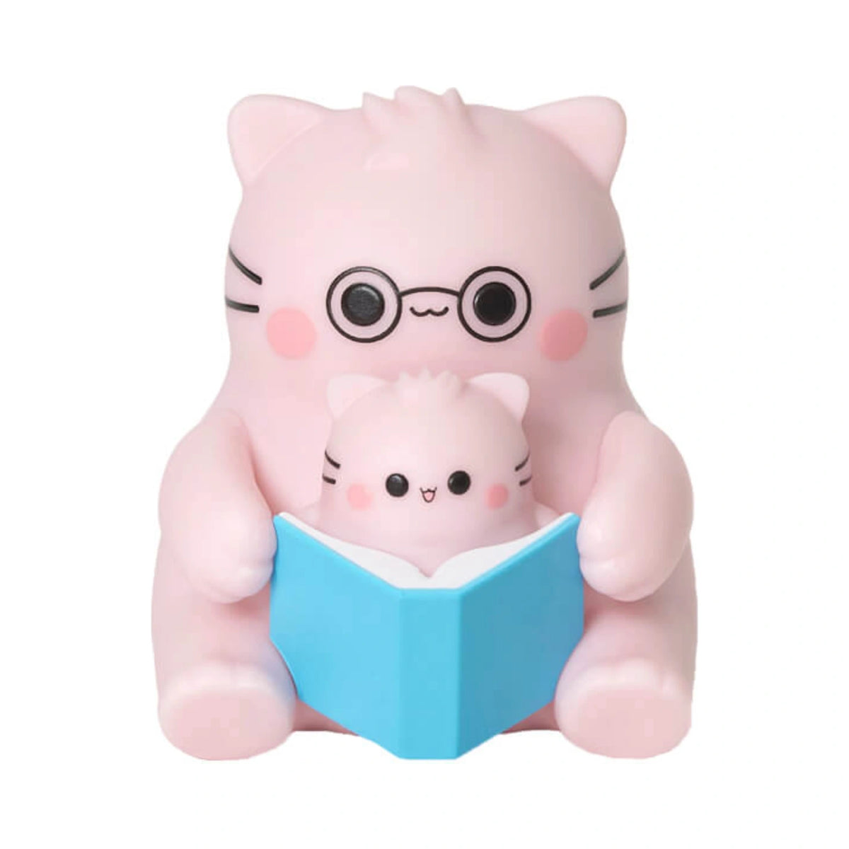 Pembe the Pink Cat mini figurine showcasing a parent pink cat wearing round black glasses reading a blue book with a baby pink cat.