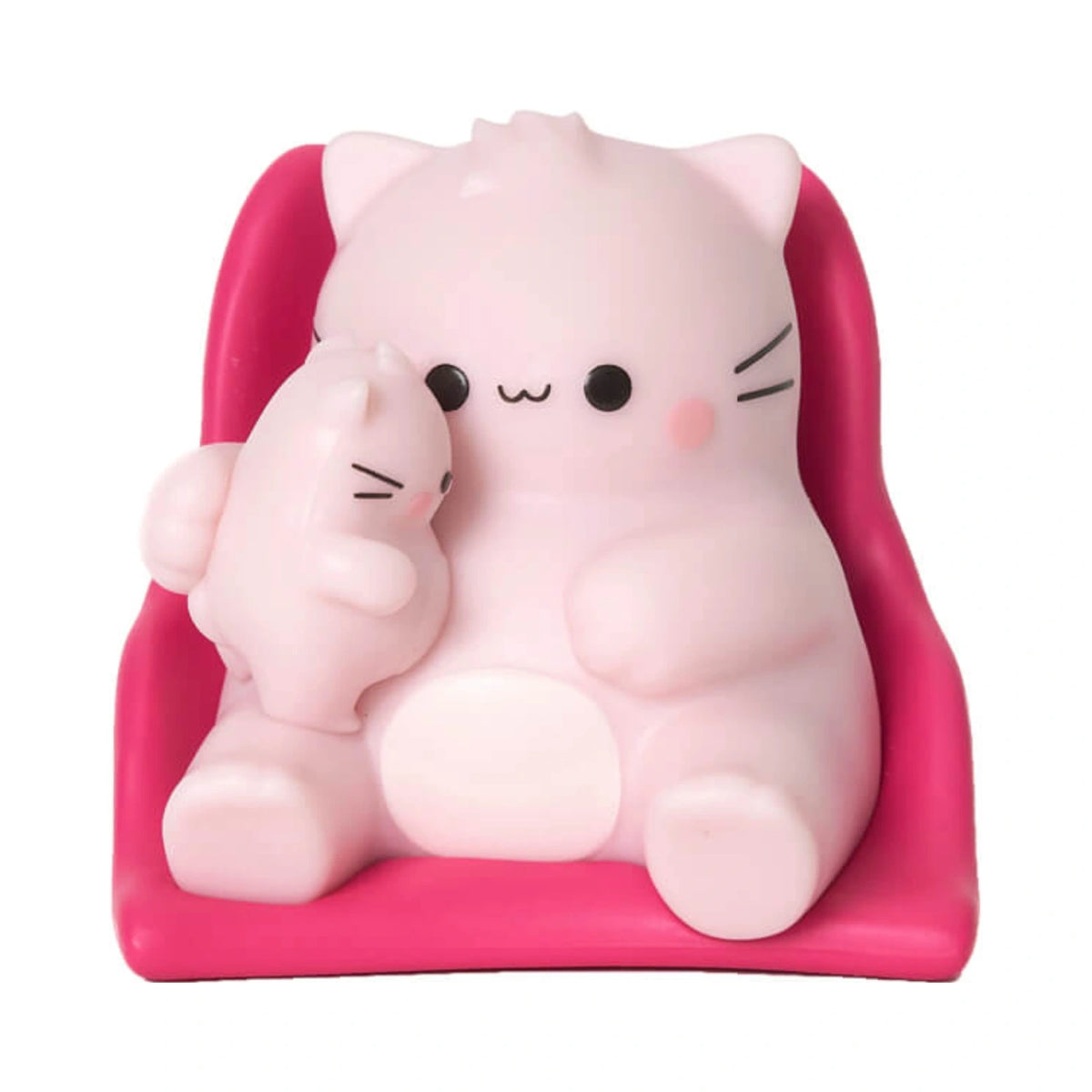 A Pembe the Pink Cat mini figurine depicting a light pink round cat holding a small kitten while sitting in a hot pink miniature chair.