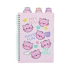 Pembe Project Book featuring a light pink cover adorned with cute pink cat face illustrations, pastel hearts, stars, and motivational text, with three colorful cat shaped tabs protruding from the top and a mint green spiral binding.