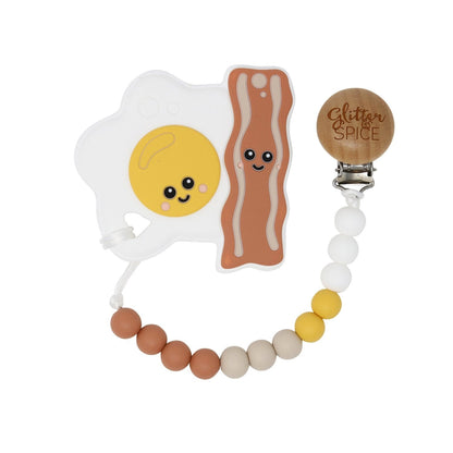 Glitter & Spice Eggs and Bacon Silicone Teether with Pacifier Clip Glitter & Spice Eggs and Bacon Silicone Teether with Pacifier Clip 